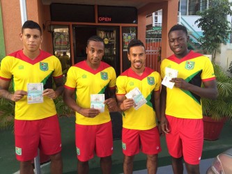 (L-R) Matthew Briggs, Neil Danns, Sam Cox and Marcel Barrington proudly displaying their Guyanese Passports. 