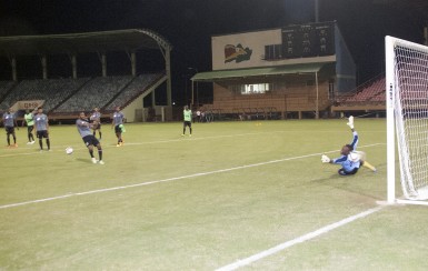Walter Moore (centre) firing a left footed effort past custodian Akel Clarke during a shooting drill at the National Stadium in Providence ahead of their second leg in the 2018 FIFA World Cup Qualifiers against St. Vincent and the Grenadines. (Orlando Charles photo) 