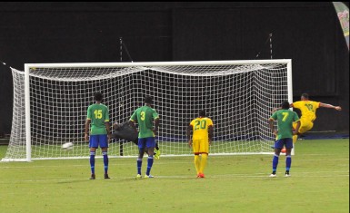 Neil Danns of Guyana (right) scoring his side’s equalizing goal from the penalty mark during their hard-fought 2018 FIFA World Cup Qualifier against St. Vincent and the Grenadines