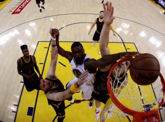 Golden State Warriors forward Harrison Barnes (40) dunks the ball over Cleveland Cavaliers guard Mike Miller (18) and center Timofey Mozgov (20) in game five of the NBA Finals at Oracle Arena on Sunday. Ezra Shaw-Pool Photo via USA TODAY Sports 