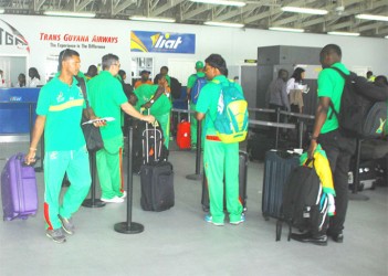 Shivnarine Chanderpaul, left, and some other members of the Amazon Warriors team prior to the team’s departure for Barbados yesterday. (Orlando Charles photo) 