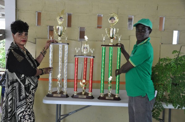 President of the GDA Faye Joseph (left) and organiser Mark Wiltshire pose with the Father’s Day tournament trophies yesterday.