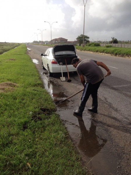 Brijraj Ramsaroop cleaning up along the  East Coast Highway 