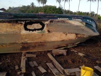 The fibreglass boat that was left abandoned by the coast guards at the No 43 koker after it encountered a leak. 