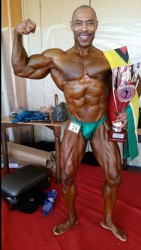 Hugh Ross posing with his NABBA championship trophy along with the Golden Arrowhead following his win yesterday in Malta. 