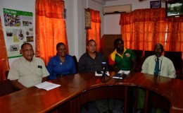 The GRFU top brass and coach of the men’s national rugby team, Theo Henry (second from right) pose for a photo following yesterday’s press briefing at the GOA’s headquarters in Kingston

