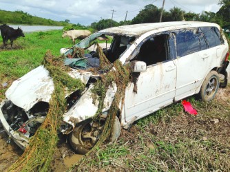 The car after it was pulled from the swollen trench in the background