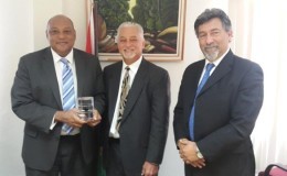 Minister of Governance, Raphael Trotman (left), with REPSOL executives Allan E. Kean (centre) and Giancarlo Ariza (GINA photo)