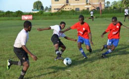 Action between Morgan Learning Centre and Tutorial Secondary at the Ministry of Education ground in the Digicel Secondary School Football Championship
