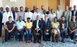 FIFA Head of Associations Primo Corvaro (4th from right) and GFF Normalization Committee Chairman Clinton Urling (4th from left) are all smiles along with the members of the Normalization Committee, GFF Associations and Affiliates following the conclusion of the GFF Extraordinary Congress at the Marriott Hotel