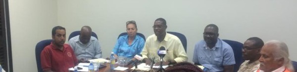 Minister of Public Infrastructure David Patterson (centre) flanked by other stakeholders at the media briefing.