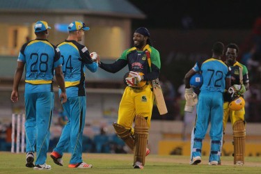 Kevin Pietersen congratulates Chris Gayle for his incredible innings. — at Beausejour Stadium. 