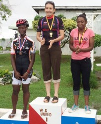 The top women’s performers are recognized on the podium yesterday  afternoon. From left are Toshwanna Doris, first place finisher, Claire Fraser-Green and Marica Dick 