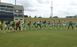 National U17 Coach Garvin Nedd doing catching drills with the team during their first day of training at the Guyana National Stadium (Clifton Ross photo)
