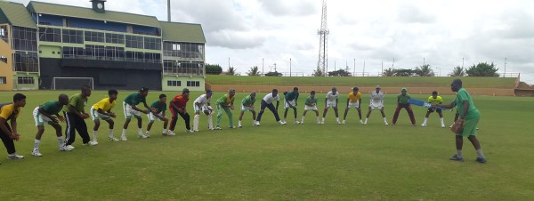 National U17 Coach Garvin Nedd doing catching drills with the team during their first day of training at the Guyana National Stadium (Clifton Ross photo) 