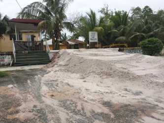 A sand ramp built from the road to the seawall  