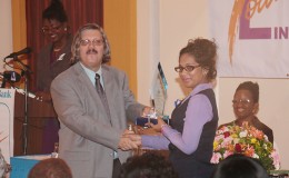 Cassandra Sunthgolam being presented with one of her awards by Managing Director of RBL John Alves.
