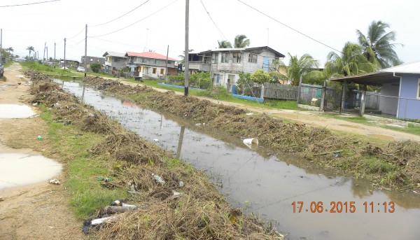 Two canals partially cleaned by the residents in B Field Sophia. (Ministry of Public Infrastructure photo)