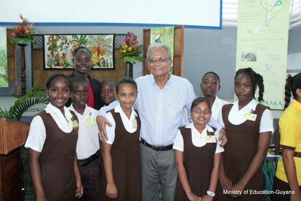 Education Minister Dr Rupert Roopnaraine with some of the students who attended.