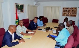 Minister of Governance, Raphael Trotman, third from left, meeting with the team. (GINA photo)