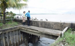 Minister of Public Infrastructure, David Patterson (right) and Engineering Consultant, Walter Willis during a visit today to the Kingston outfall which is fully operational. (GINA photo)