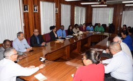 Minister of Business Dominic Gaskin (left) addressing members of the Private Sector Commission (PSC) during the meeting (GINA photo)