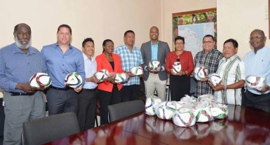 Members of the GFF Normalization Committee and officials of the Ministry of Indigenous Affairs posing for a photo opportunity following the handing over ceremony held at the latter’s head office. (Orlando Charles photo) 