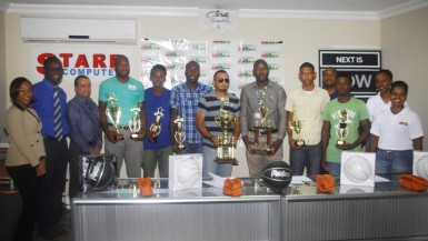 The various team and individual winners alongside members of the GABA executive displaying their prizes following the conclusion of the presentation ceremony held at the Starr Computers Conference Room on Brickdam.