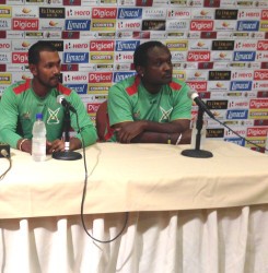 From left: Guyana Amazon Warriors skipper Denesh Ramdin  and head coach Carl Hooper at a CPL press conference in St Kitts yesterday. 