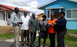 Minister in the Ministry of Communities Keith Scott (third from left) during the visit. (Ministry of Communities photo)