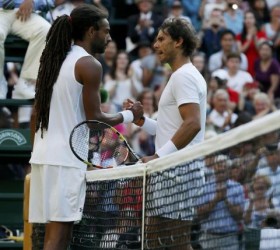 Dustin Brown of Germany shakes hands with Rafael Nadal of Spain after winning their match at the Wimbledon Tennis Championships in London, July 2, 2015.  Reuters/Stefan Wermuth 
