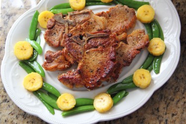 Pan-seared Pork Chop with Plantains & Sugar-snap Peas Photo by Cynthia Nelson 