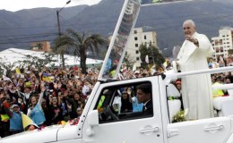 Pope Francis greets the faithful from a popemobile in Quito, Ecuador, July 5, 2015. Reuters/Guillermo Granja