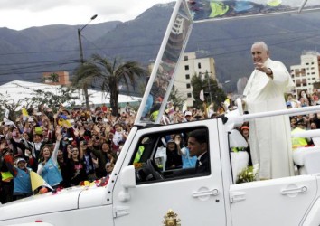 Pope Francis greets the faithful from a popemobile in Quito, Ecuador, July 5, 2015. Reuters/Guillermo Granja