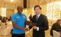 Steve Ninvalle receiving his AIBA tie from president of the body Dr. Ching-Kuo Wu on Wednesday during the four-day congress in Doha, Qatar.
