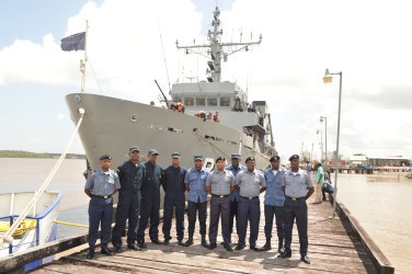 The recently trained coast guards with the training vessel (GDF photo) 