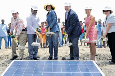 Prime Minister Portia Simpson Miller (third left) breaks ground for the development of the first utility-scale solar energy power plant in Jamaica. Joining the Prime Minister are (from left) Member of Parliament and Minister of Local Government and Community Development Noel Arscott; Minister of Science Technology, Energy and Mining Phillip Paulwell, CEO WRB Energy Inc and Content Solar Ltd, Robert Blenker; President and CEO Jamaica Public Service Kelly Tomlin; and Chargé d’ affaires at the US Embassy Elizabeth Martinez.  