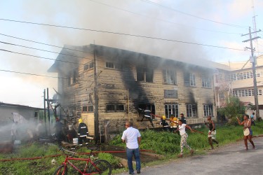 The firefighters working to contain the blaze at Hope Street, Tiger Bay yesterday.