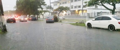 Thomas Street outside the Georgetown Public Hospital was heavily flooded last evening after rainfall throughout the day. (Photo by Keno George)   Photo: Thomas Street1.jpg Caption: Thomas Street opposite the Georgetown Public Hospital was heavily flooded yesterday evening after a day of rain. (Photo by Keno George)