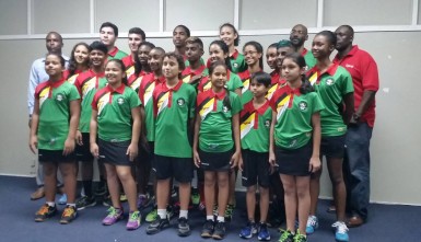 The Guyana Junior Caribbean Area Squash Association (CASA) championship team posing for a photo opportunity alongside Digicel Event and Sponsorship manager Gavin Hope (1st from right) and Ansa McAl Representative Jamaal Douglas (1st from left) following the end of the presentation ceremony. 
