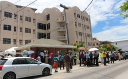Employees outside of the CLICO building following the tremor (Keno George photo)