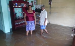  Altaf Ahamad and his wife in their flooded apartment
