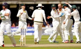 Australia’s Nathan Lyon celebrates the wicket of England’s Ian Bell (L) with team mates. Action Images via Reuters/Andrew Couldridge
