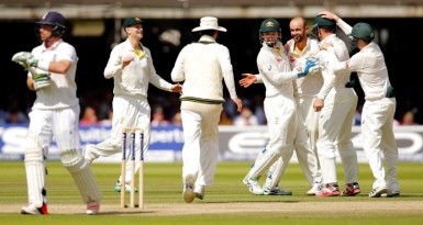 Australia’s Nathan Lyon celebrates the wicket of England’s Ian Bell (L) with team mates. Action Images via Reuters/Andrew Couldridge  