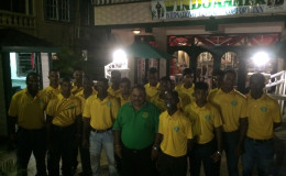 GCB President Drubahadur (center) surrounded by members of the Guyana U19 side.