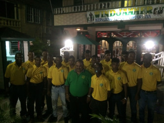 GCB President Drubahadur (center) surrounded by members of the Guyana U19 side.