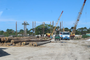 Workers driving piles at the Mandela Avenue site.