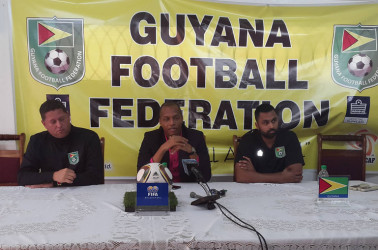 GFF Normalization Committee Chairman Clinton Urling (centre) addressing the media gathering during a press conference held at the GFF Head-Quarters while the federation Technical Director Claude Bolton (left) and Committee Member Tarig Williams look on