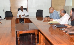 Finance Minister Winston Jordan (centre) and his team (at left), meeting yesterday with the PPP’s team on this year’s budget. (GINA photo) 