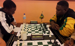 Anthony Drayton (left) of Guyana opposes Andrew Mellace of Jamaica during last year’s Umada Cup which was held in Guyana. The tournament was hosted by the World Chess Federation.